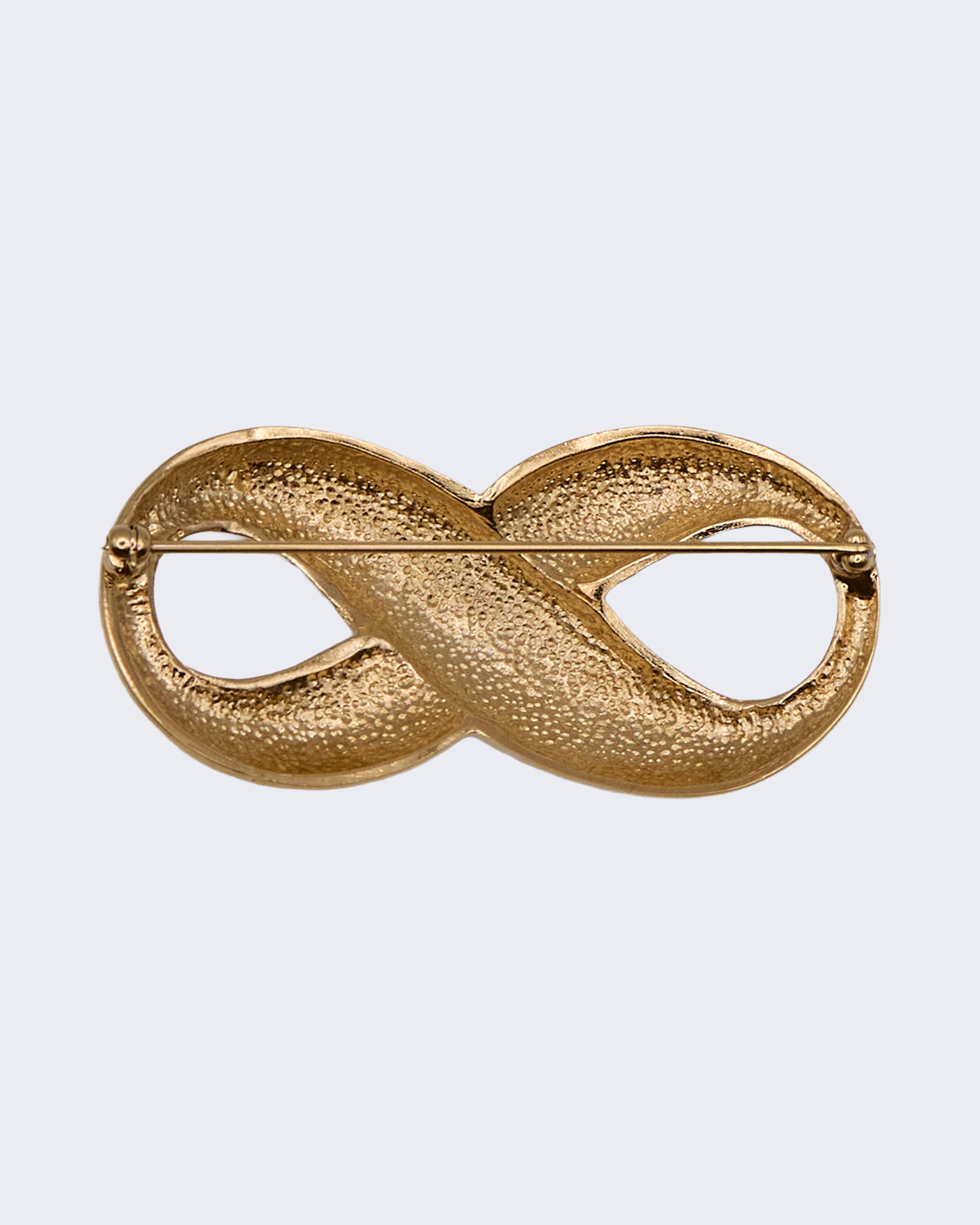 Spilla Vintage Infinito in Metallo Dorato con Cristalli – Design Elegante