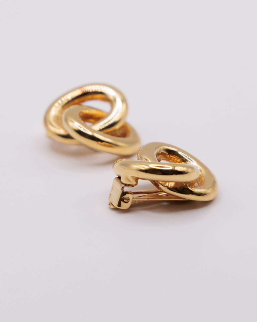 Orecchini vintage dorati a nodo intrecciato, clip anni ’80 stile designer