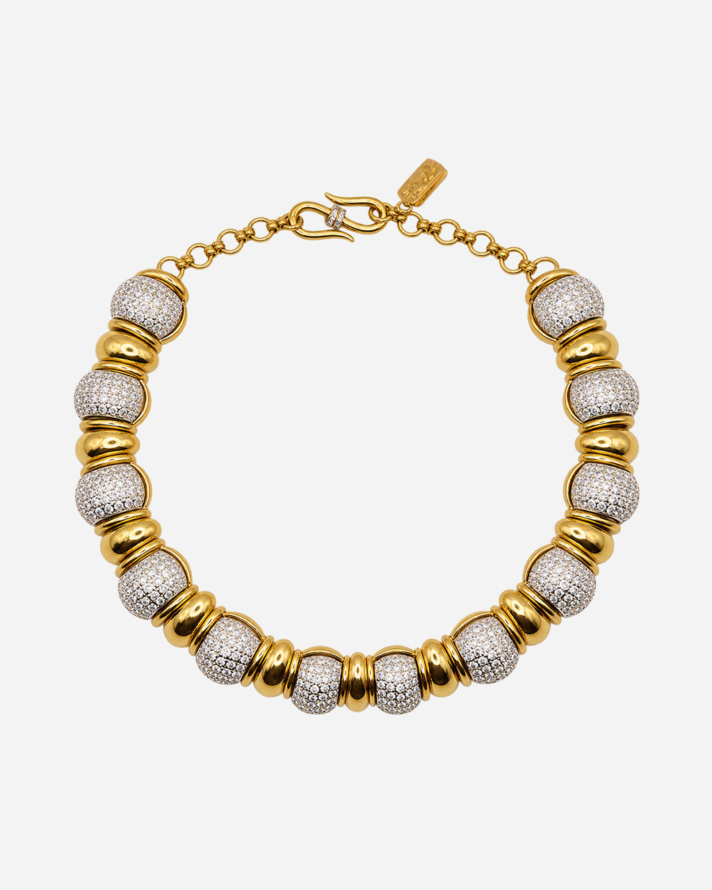 Collana Yves Saint Laurent con elementi bombati a pavé di cristalli alternati a raccordi dorati lisci.