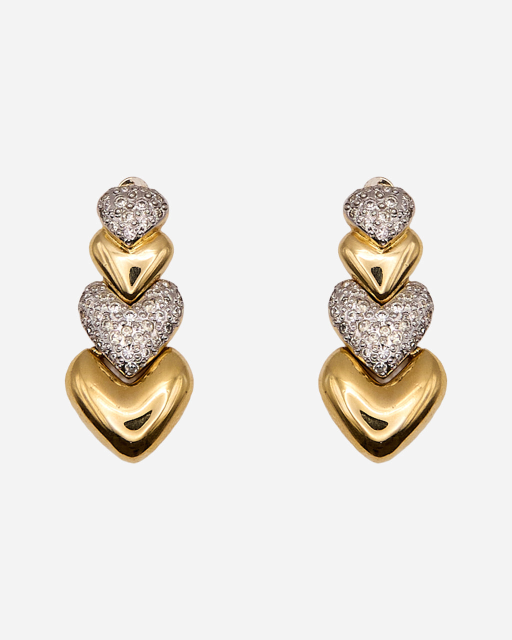 Orecchini vintage pendenti con quattro cuori di dimensioni crescenti, alternati tra dorato liscio e cristalli trasparenti.