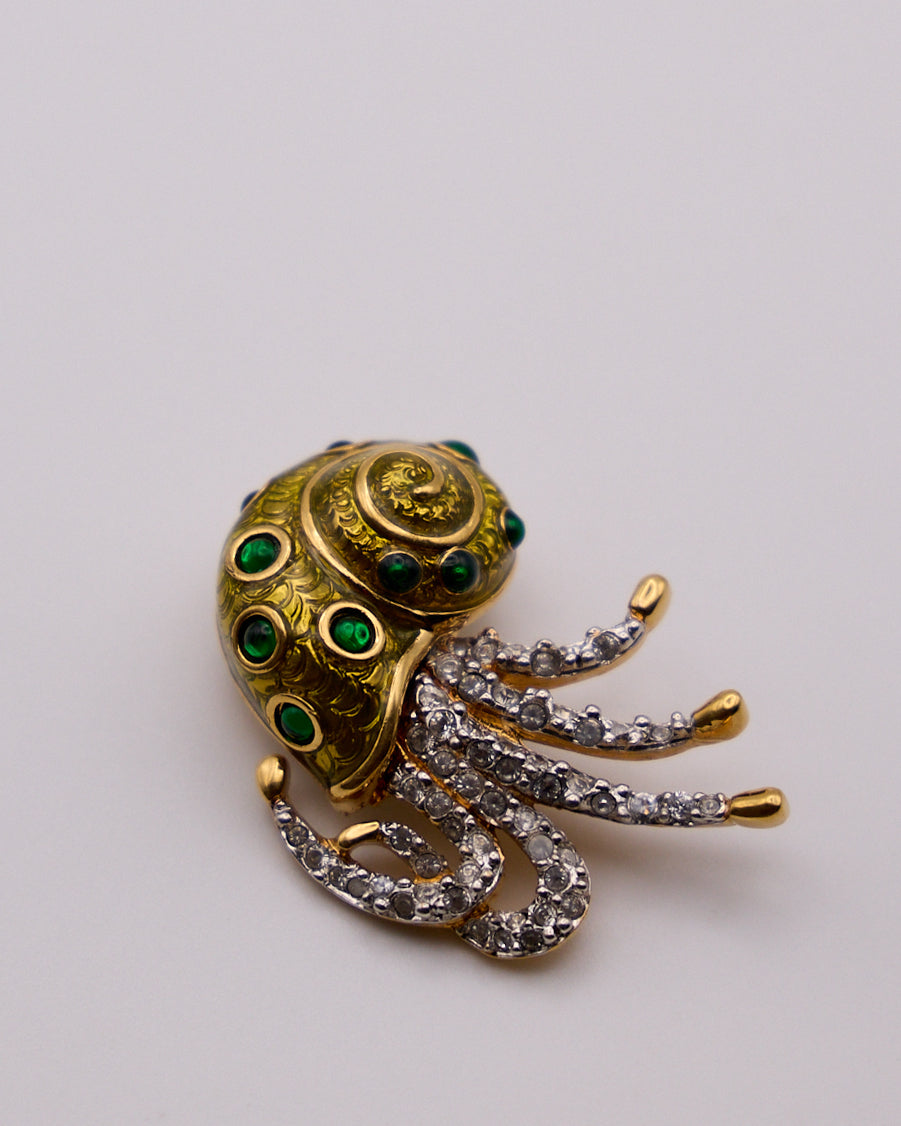 Spilla vintage a nautilus con smalto verde e cristalli