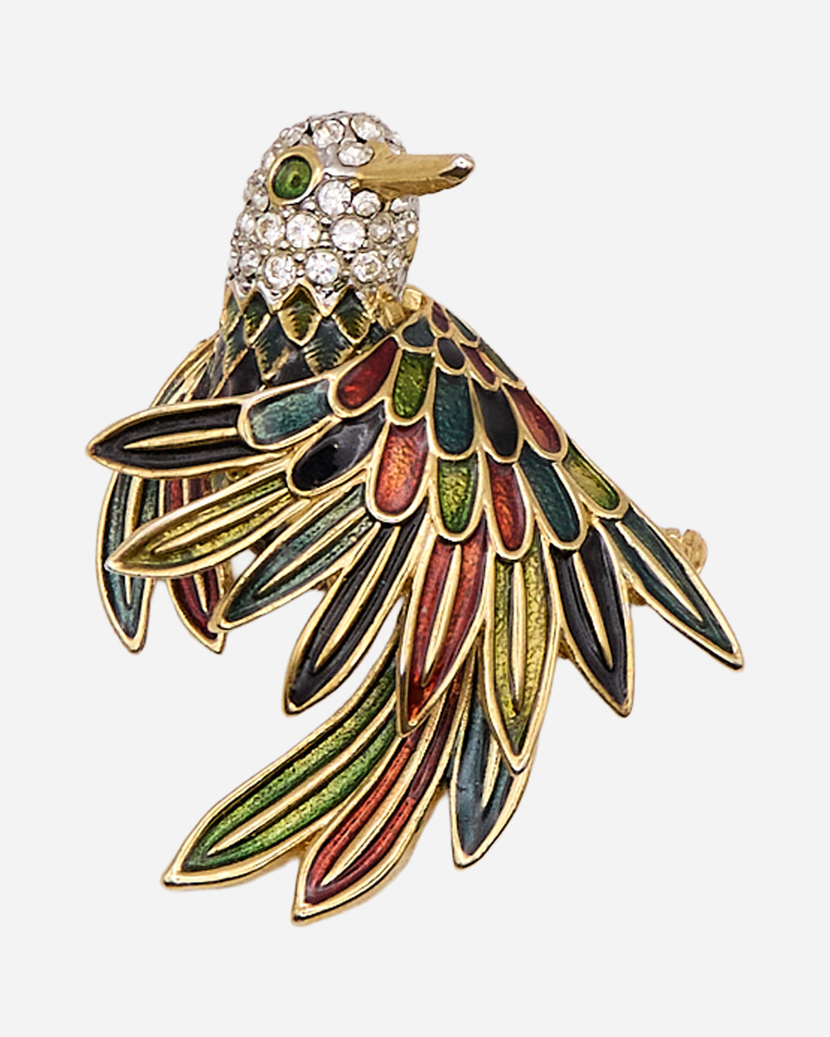 Spilla vintage a uccello dorato con piume smaltate multicolore, ali aperte, lunga coda e testa decorata da cristalli trasparenti.